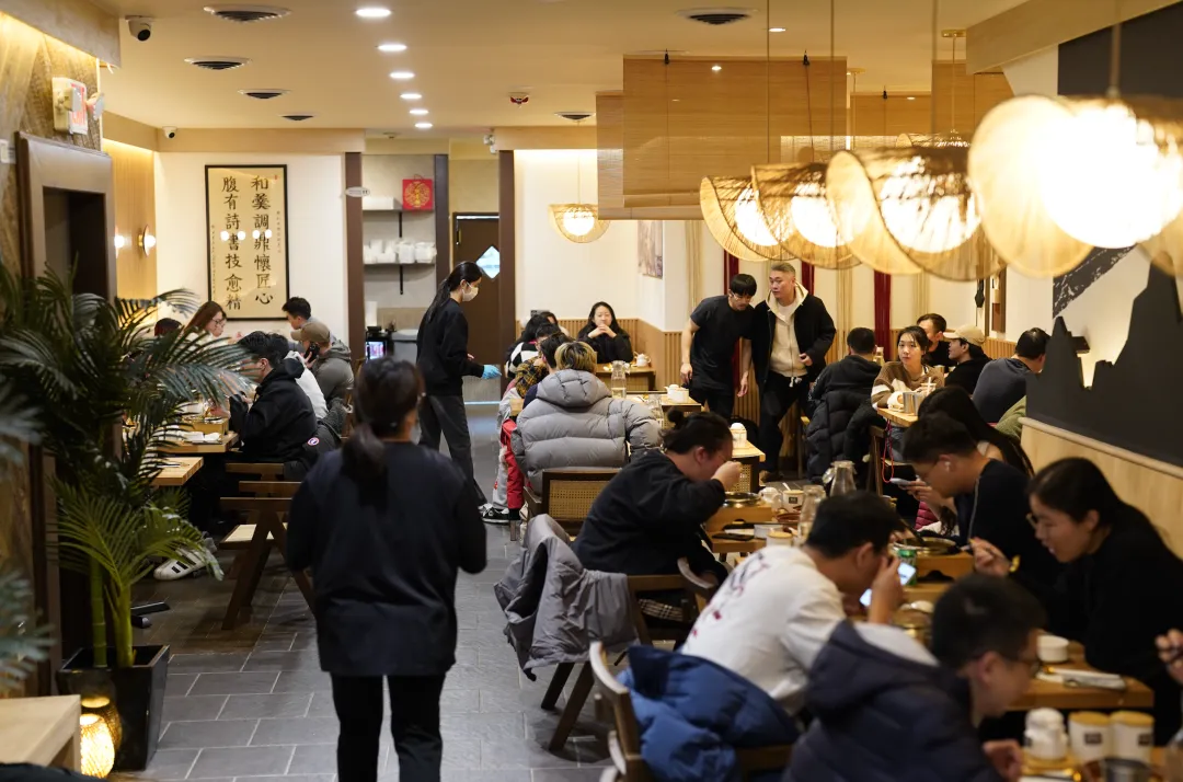 Guests dining and talking in a modern restaurant
