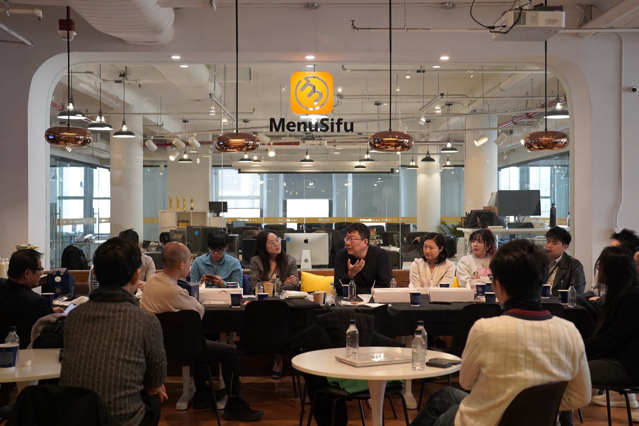 Restaurant owners sharing ideas around a table in New York