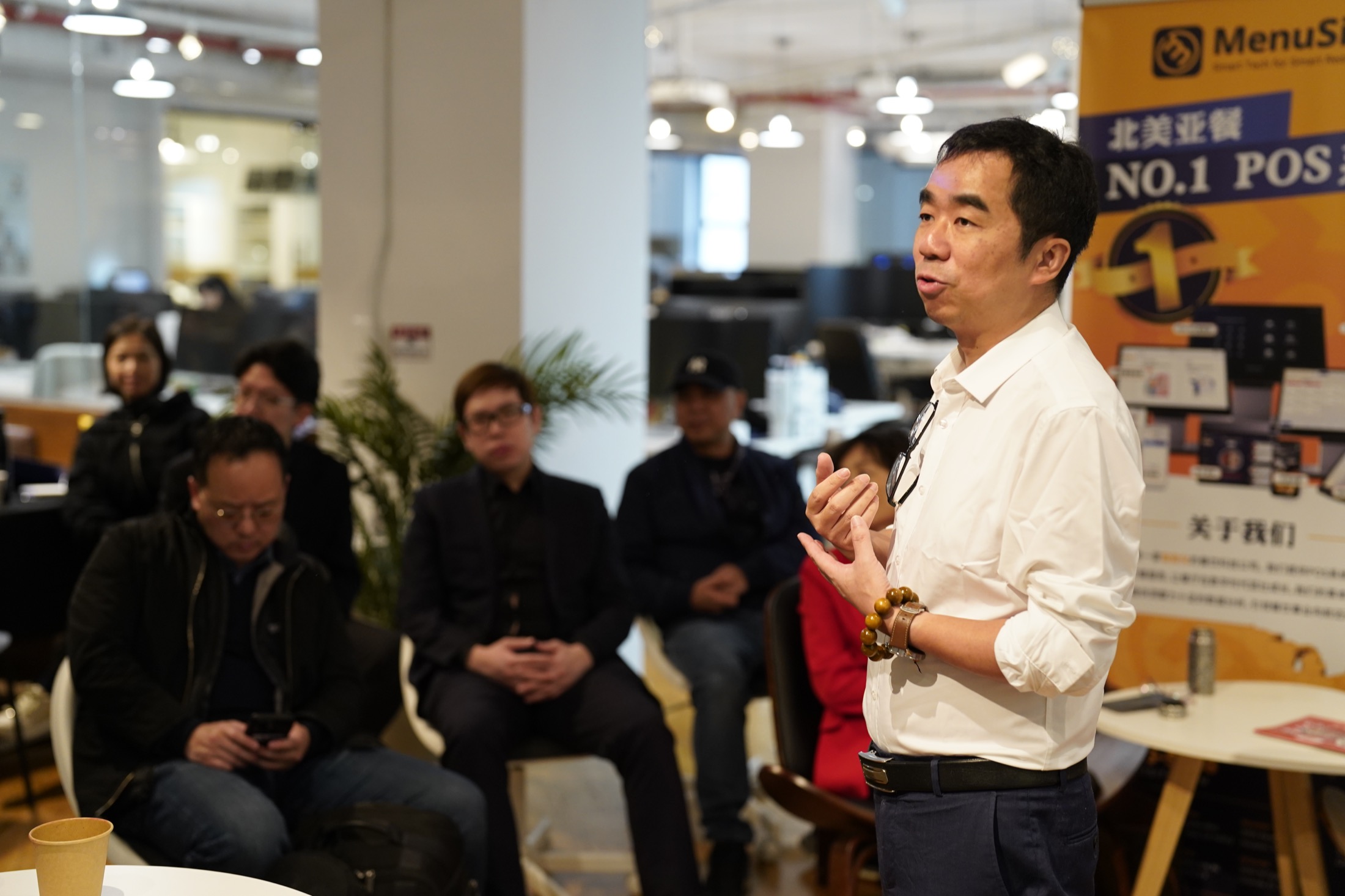 A speaker addressing restaurant owners at a Restaurateur Club gathering in New York
