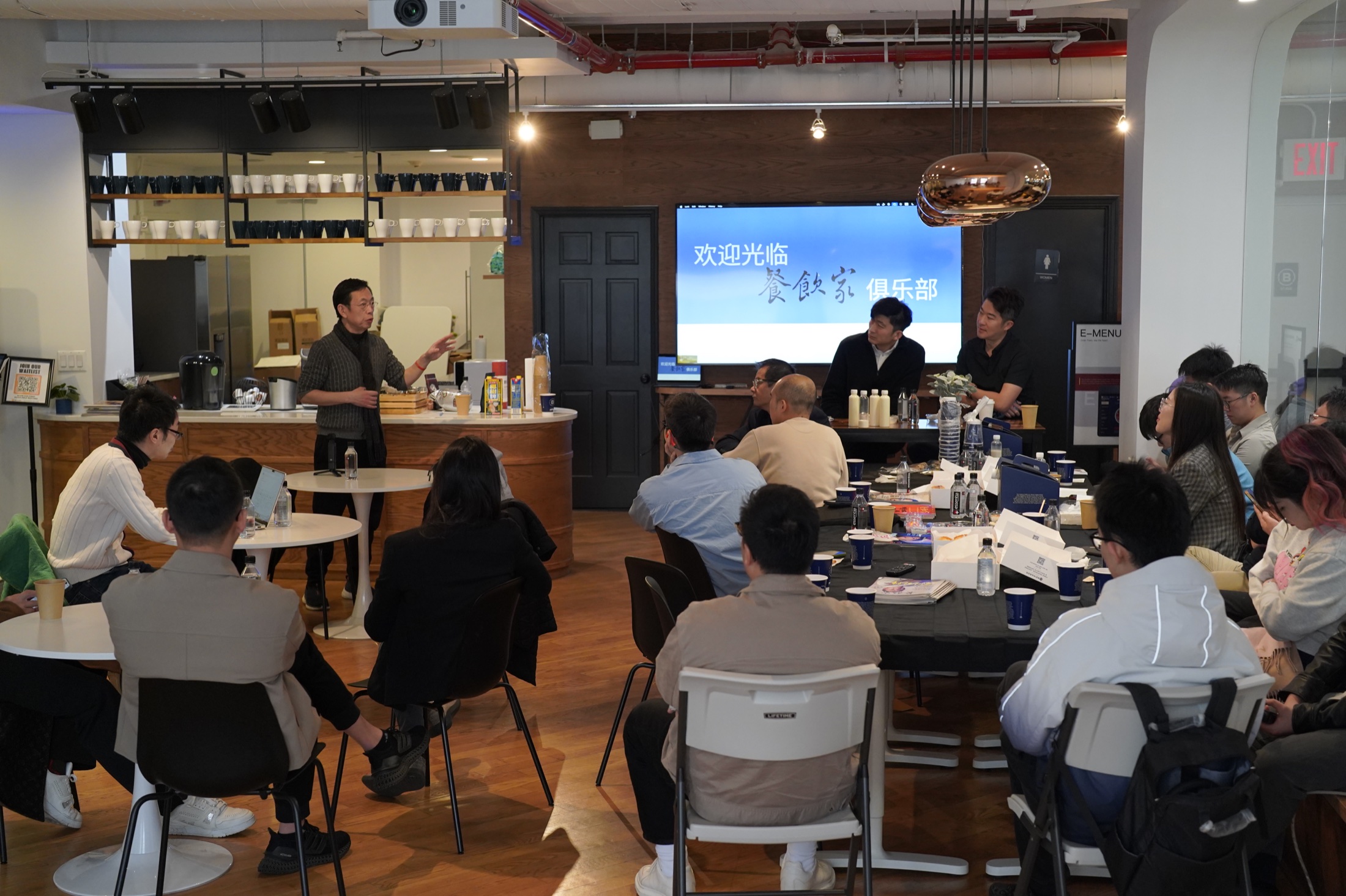 Restaurant owners exchanging ideas at a Restaurateur Club gathering in New York